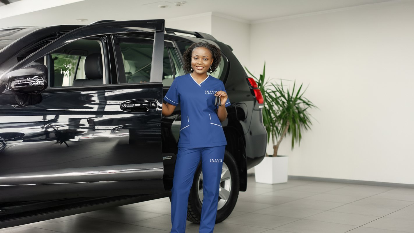 INAYA uniform beside a vehicle