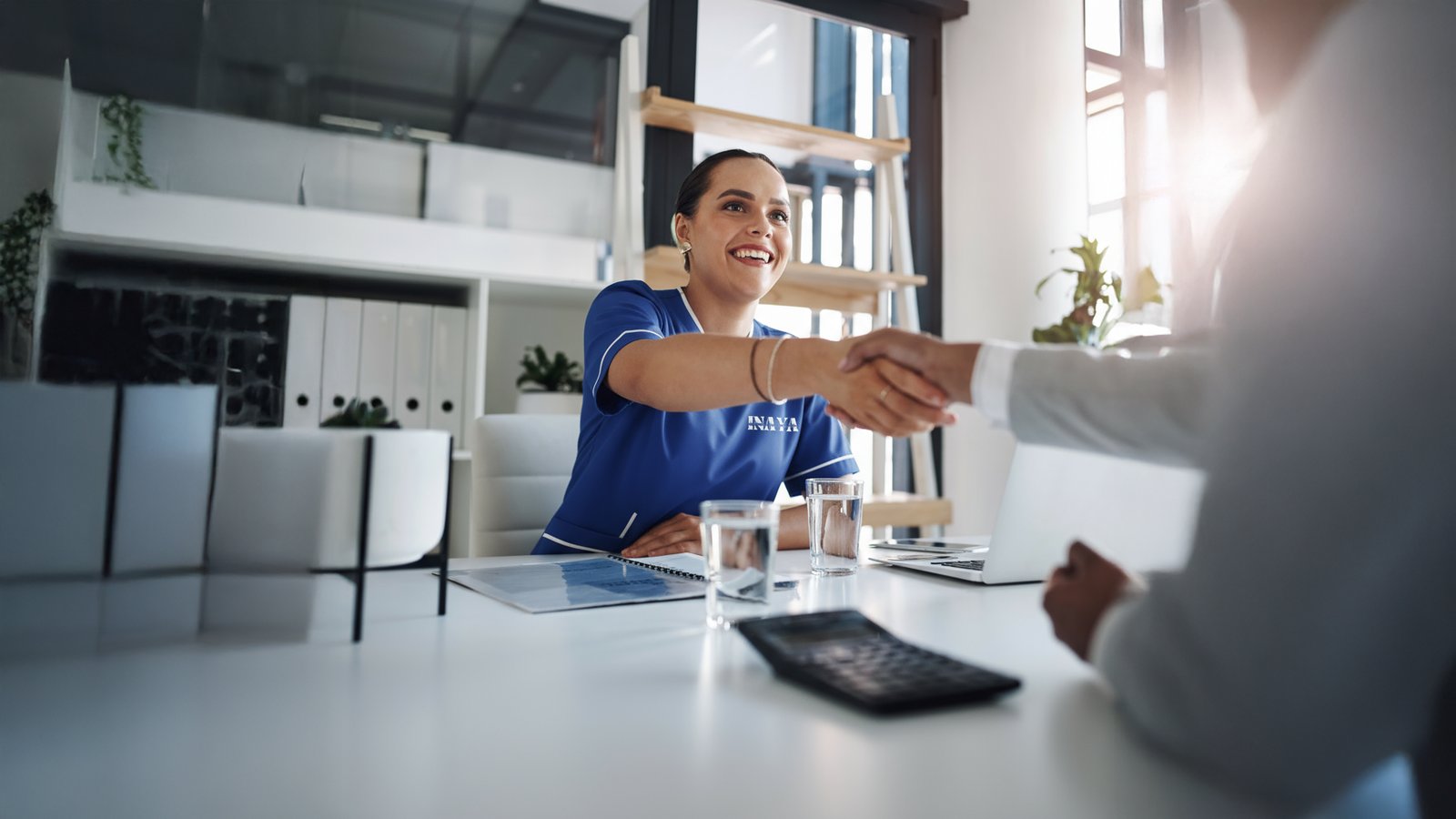 Handshake during a household-services meeting
