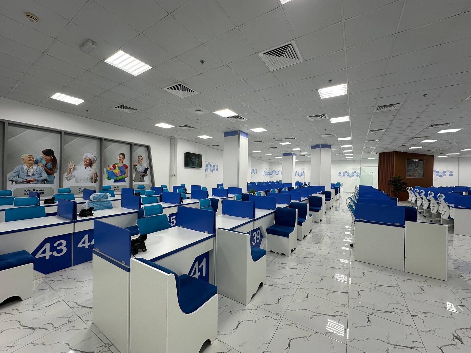 Numbered counters inside the INAYA Ajman office