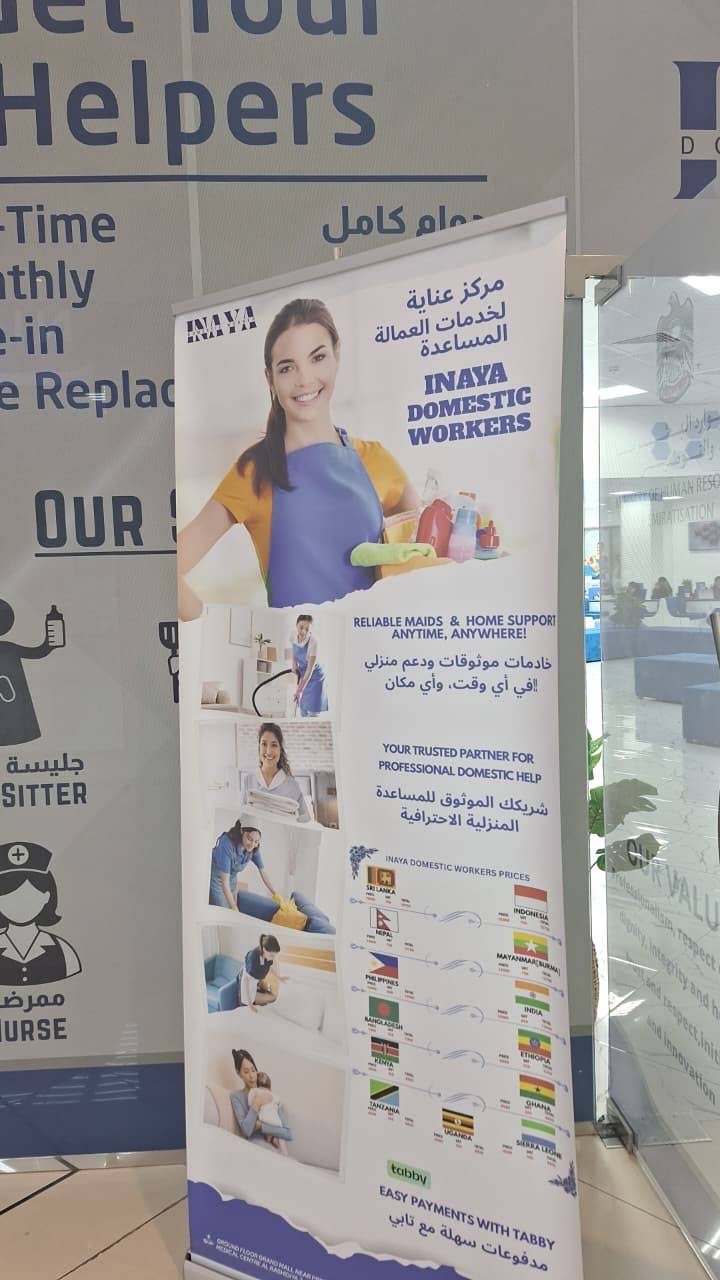 Printed company display at the INAYA office entrance