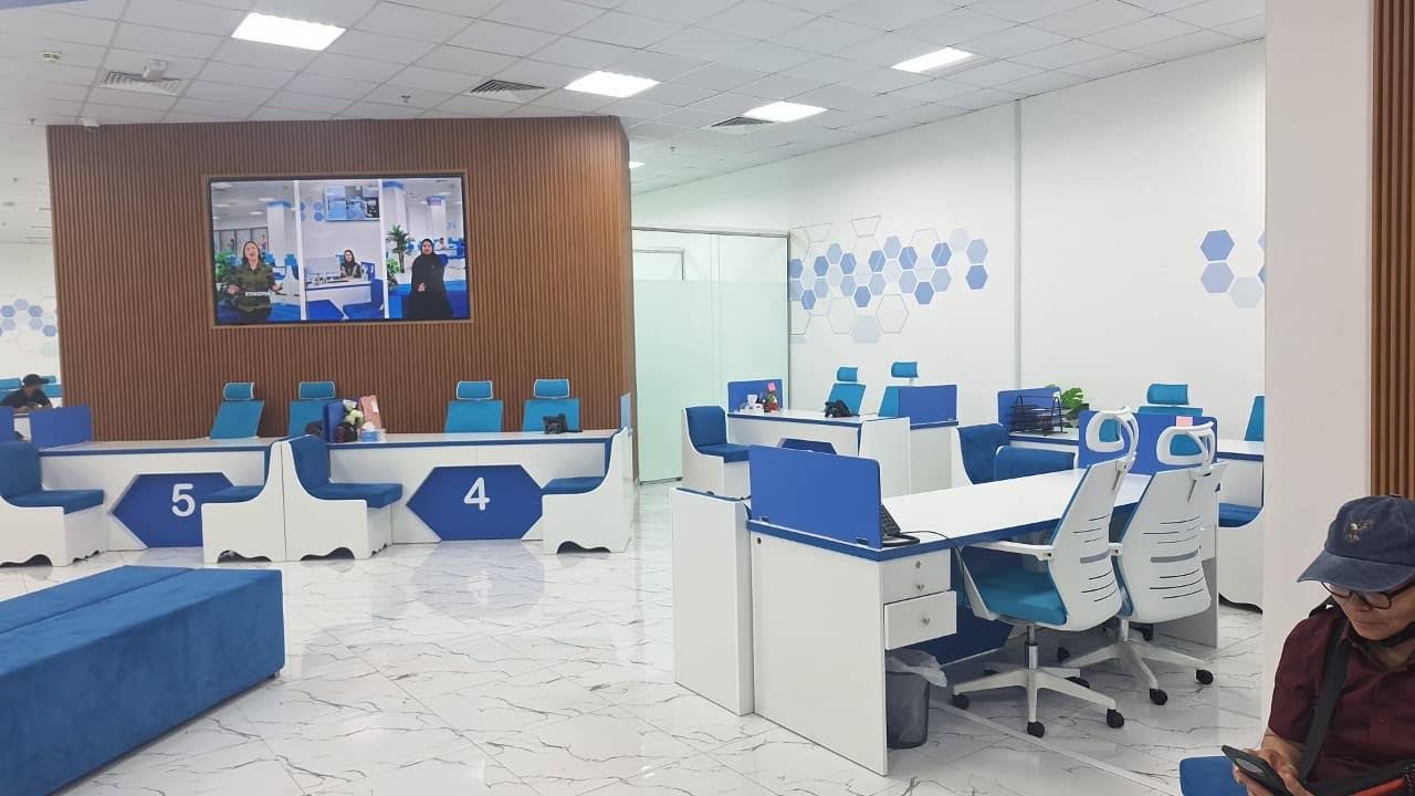 INAYA Ajman numbered service counters and waiting seats