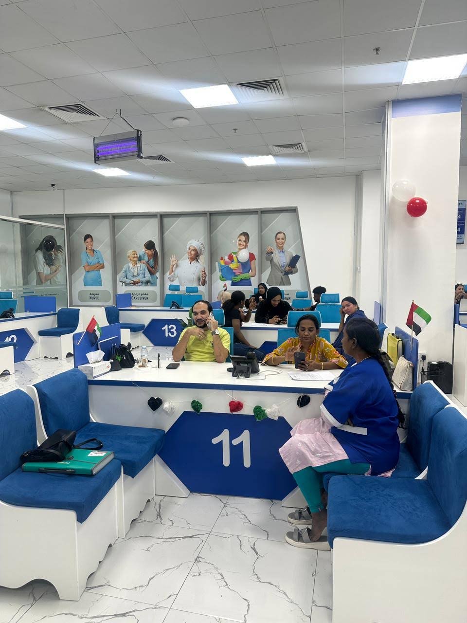 Customer seating and numbered counters inside INAYA Ajman