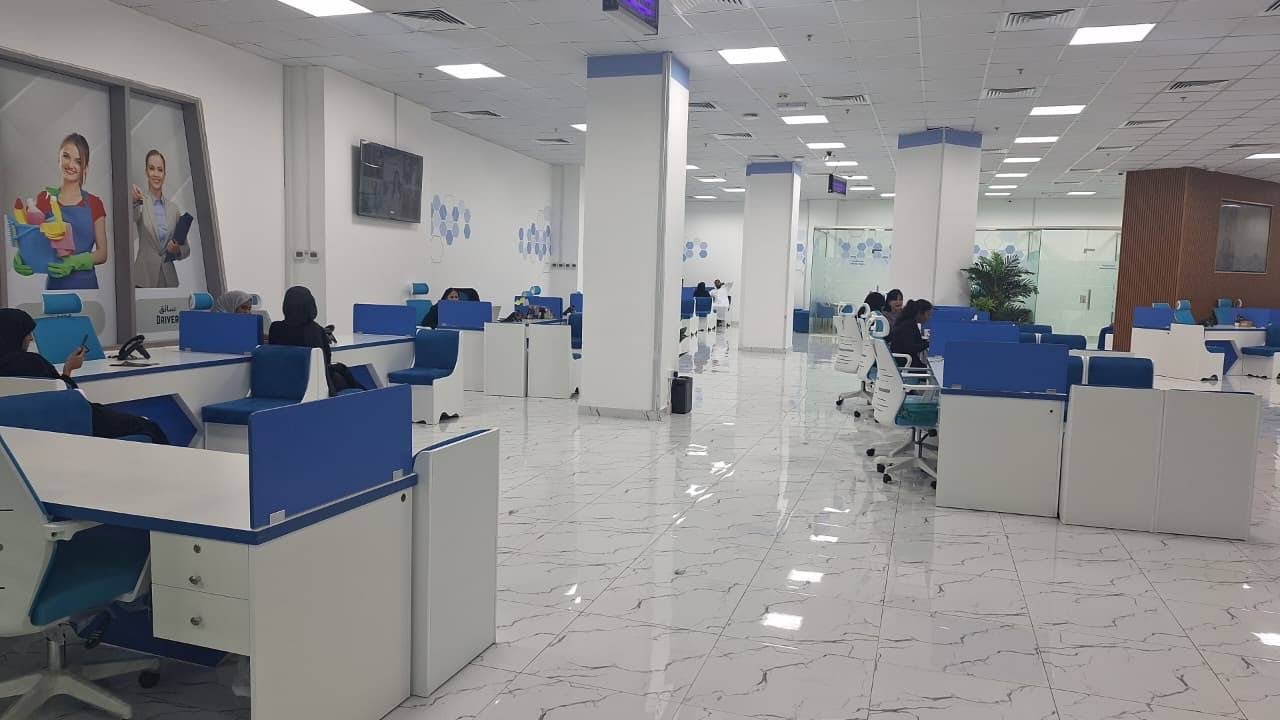INAYA Ajman office walkway and rows of counters