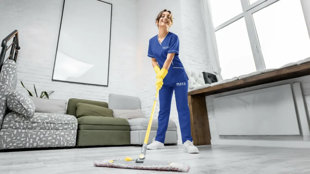 Maid operating washing machine at home