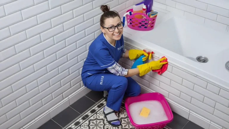 Maid folding clean clothes